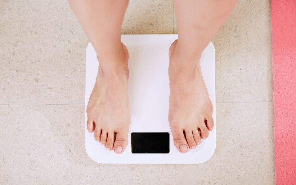 Lady standing on a scale